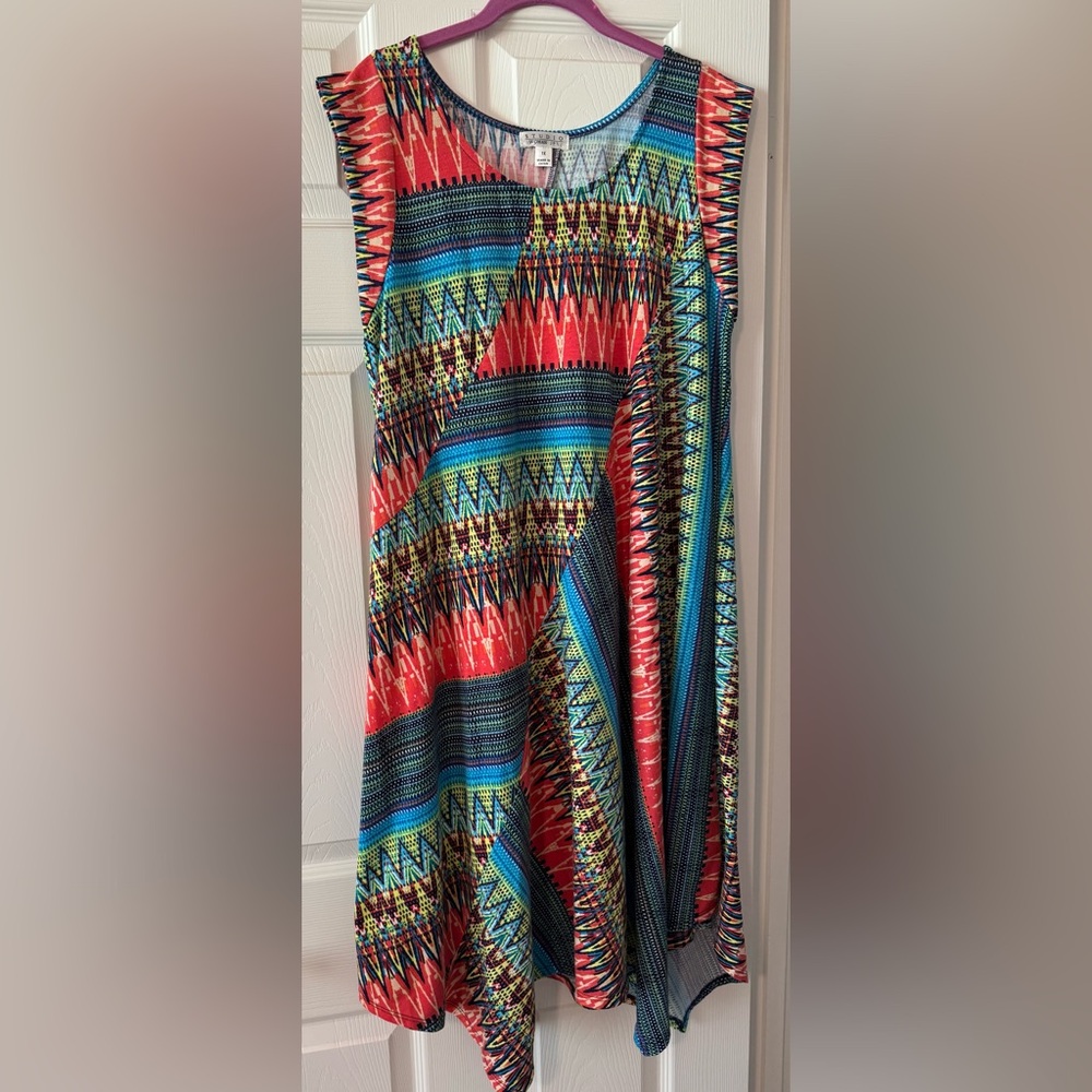 Studio Woman Dress with geometric pattern and asymmetrical hemline.